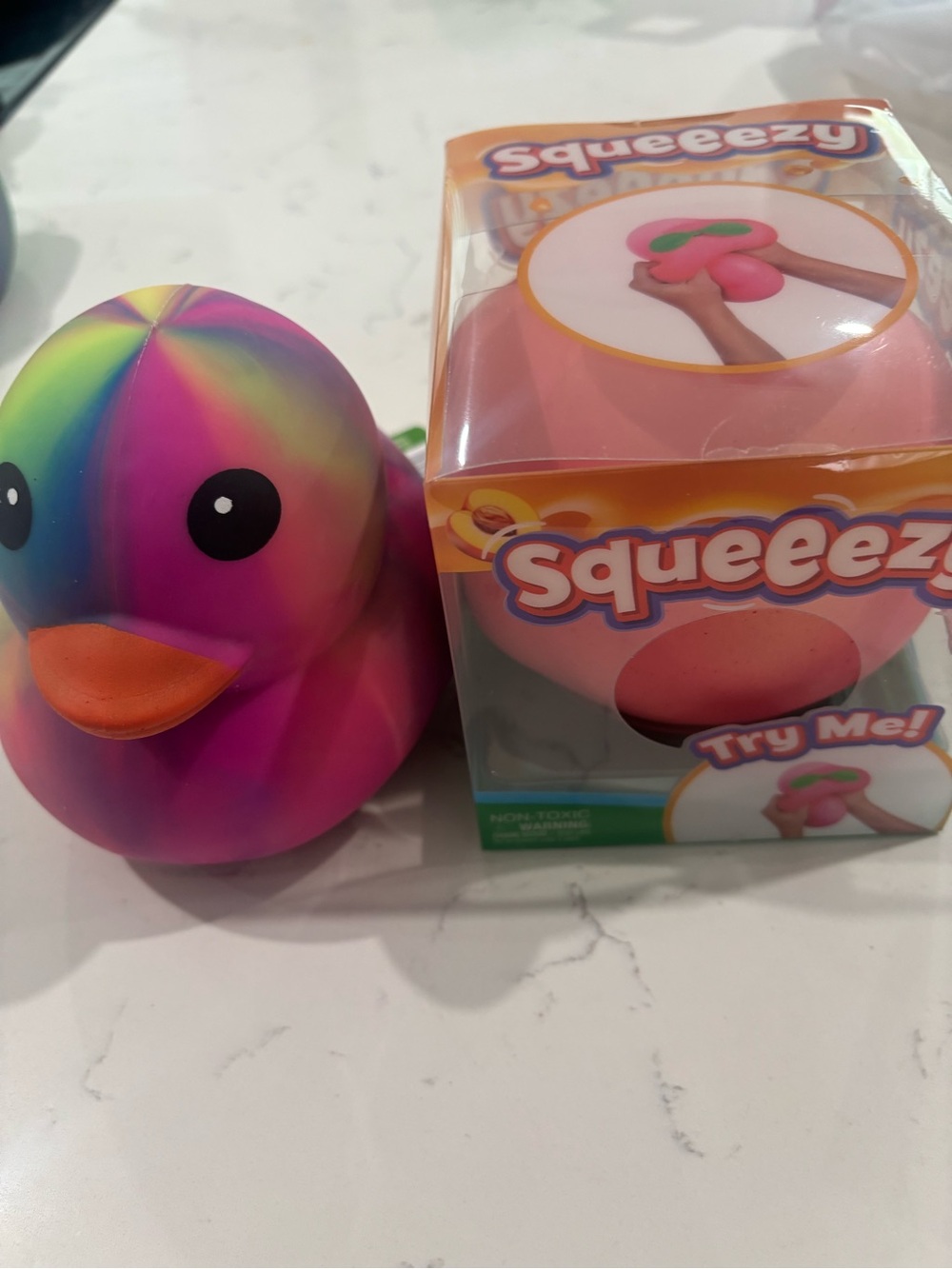 Bundle of 2:  Squeezy Rainbow Duck and Squeezy peach sunny days fidget toys